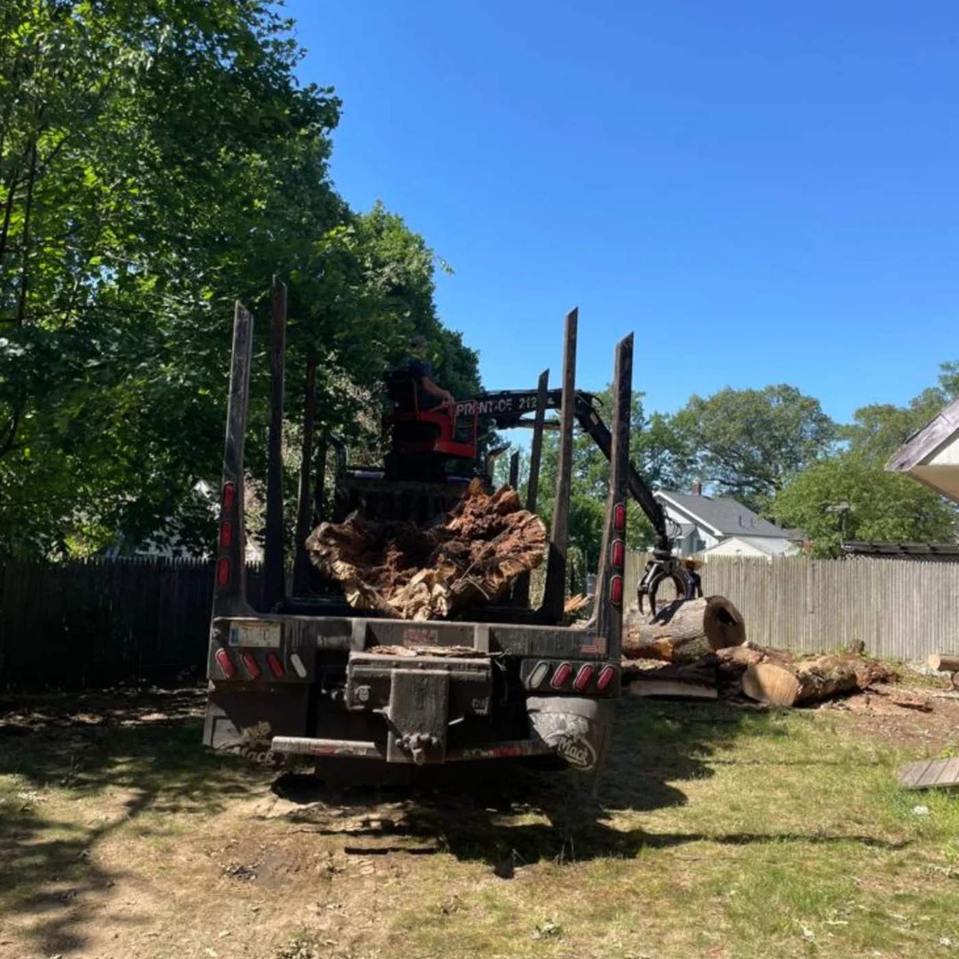 Grapple truck on a cleared lot